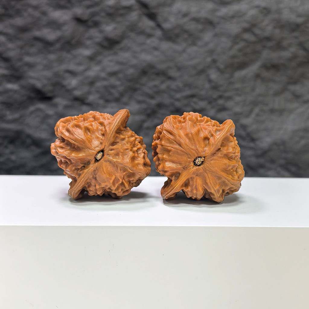 Pair of porcelain doll Wenwan walnuts by Wenwan Art, smooth-glaze finish, 38mm size, featuring detailed doll designs on each walnut.