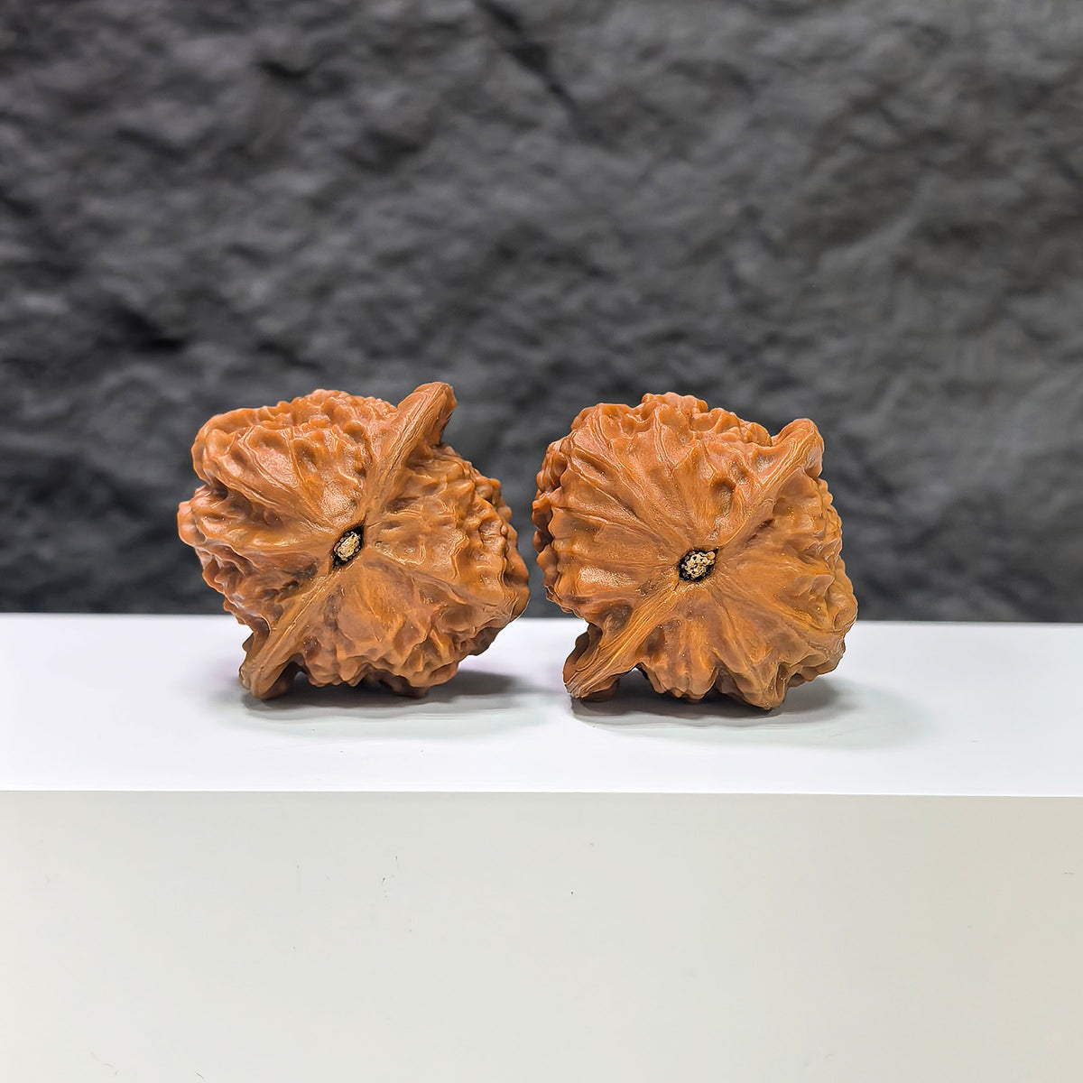 Pair of porcelain doll Wenwan walnuts by Wenwan Art, smooth-glaze finish, 38mm size, featuring detailed doll designs on each walnut.