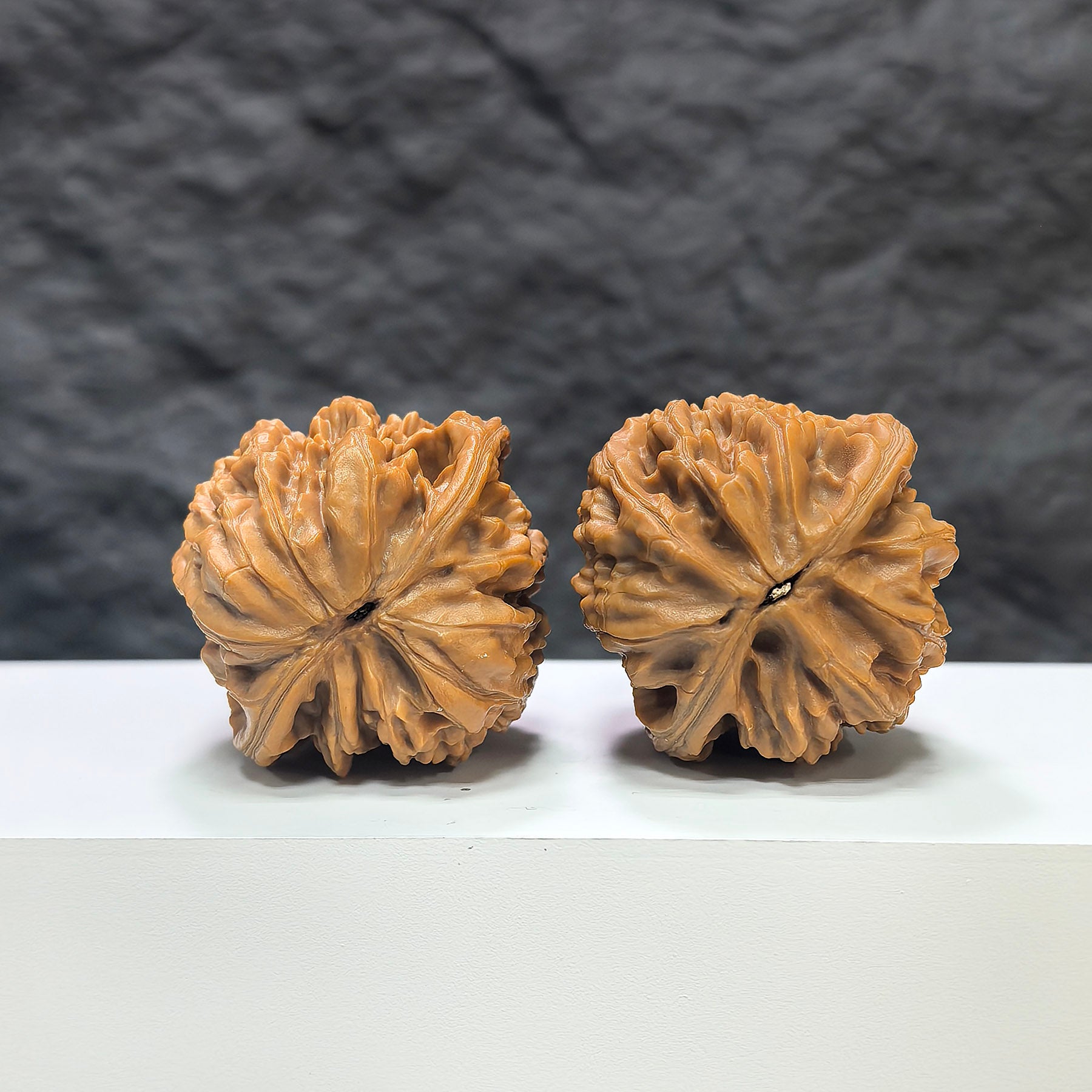 Pair of Wenwan Art Classic Scholar hand-matched Wenwan walnuts, Beijing Jixin style, 42mm x 40mm, detailed wood grain.