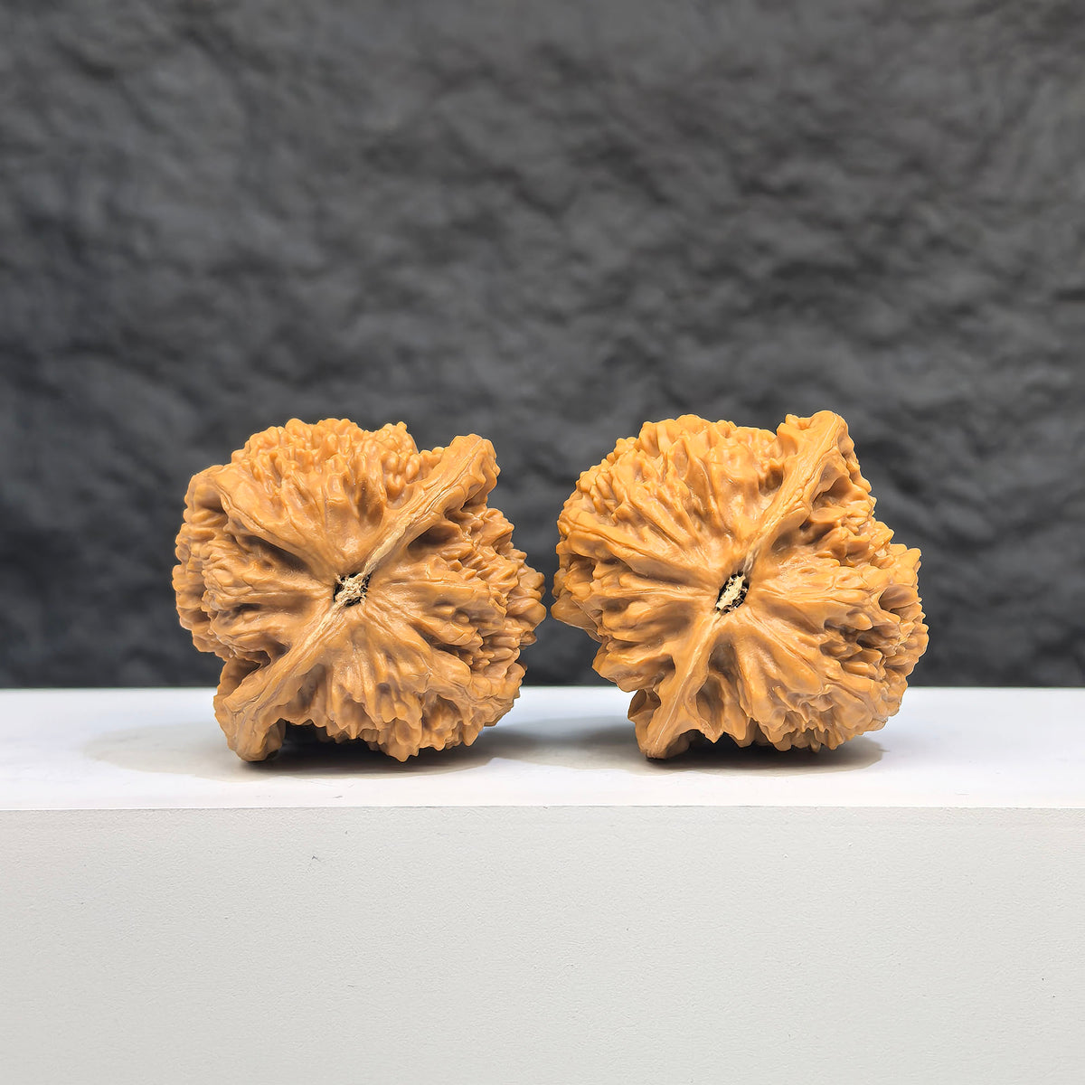 Pair of spherical Wenwan walnuts from Wenwan Art, round-profile full stars design, 38mm size, with intricate natural wood grain details.