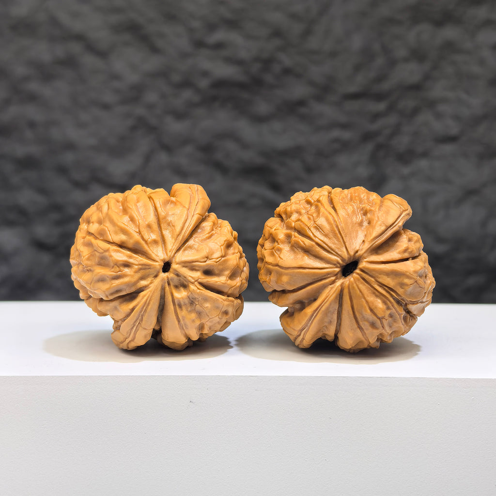 Miniature Wenwan walnut pair with Oracle Bone Script carvings, measuring 33mm x 31mm, by Wenwan Art.