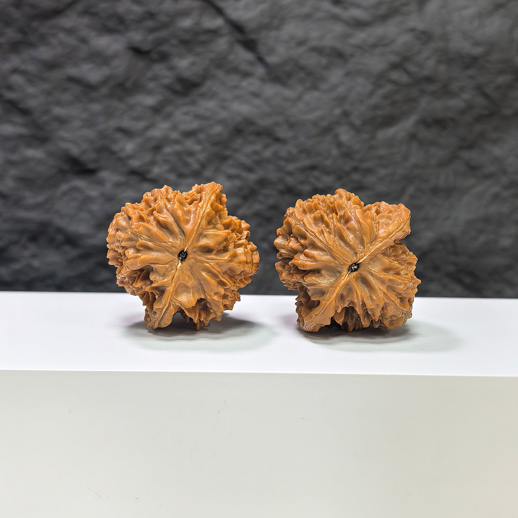 Pair of Golden Kylin Wenwan walnuts from Wenwan Art, 37mm x 38mm, showcasing intricate carvings and natural walnut texture.