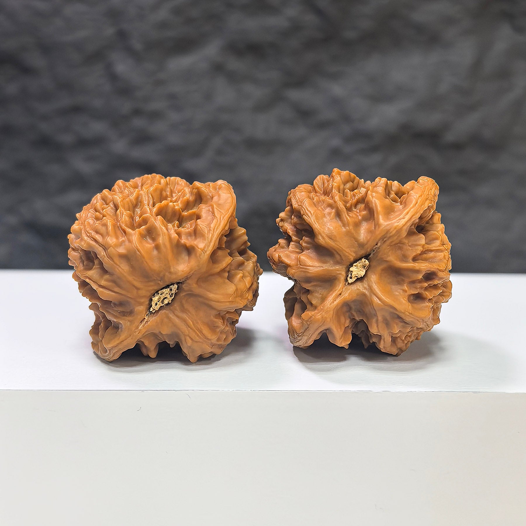 Wuling Mountain Pocket Wenwan Walnut miniature pair from Wenwan Art, 35mm size, with detailed textured walnut surfaces.