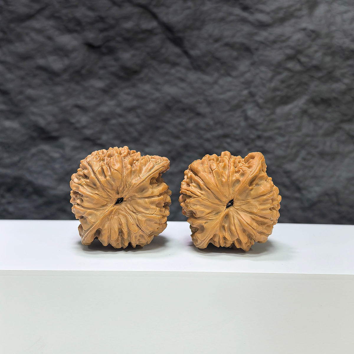 Pair of Wenwan Art Kylin Texture Classic Wenwan Walnuts, 39mm x 35mm, showing detailed carved 麒麟紋 pattern.