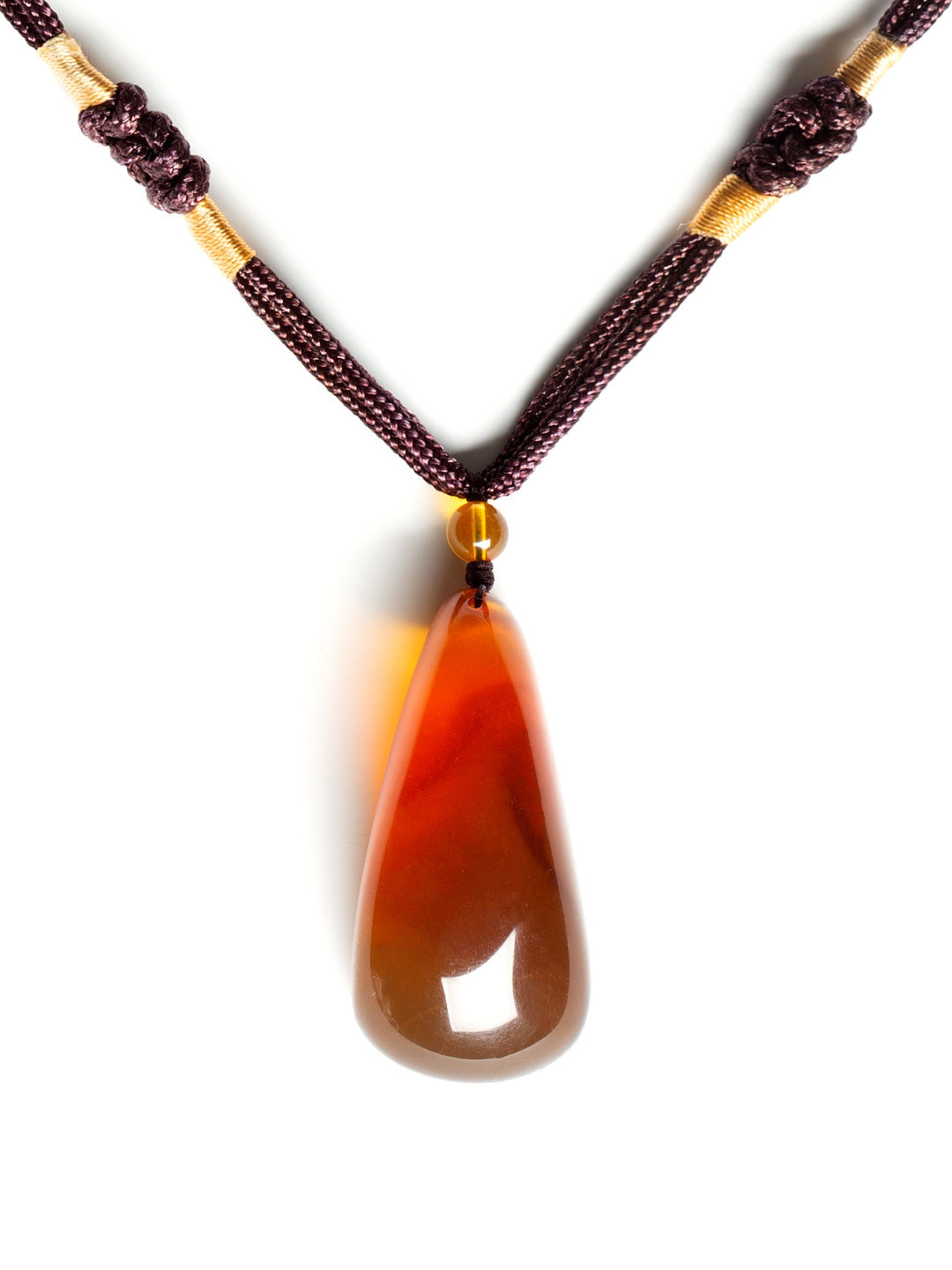 Authentic brownish-red freeform amber pendant with natural shape, weighing 12g, featuring warm, translucent amber stone.