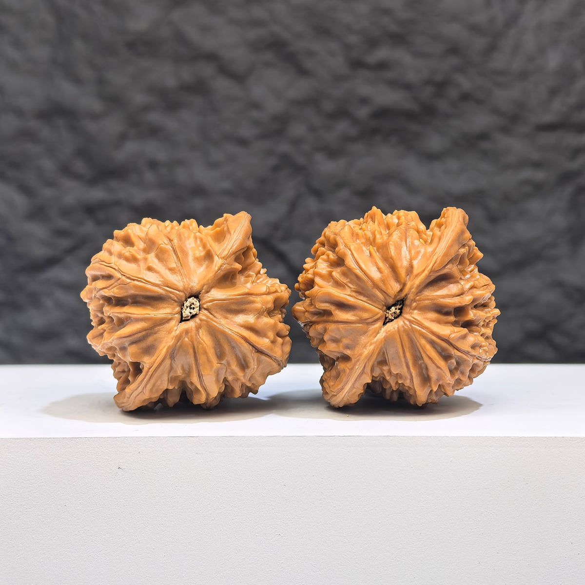 Pair of Wenwan Art Millstone Classic Wenwan walnuts, 37mm x 34mm, showcasing detailed natural stone patterns and craftsmanship.
