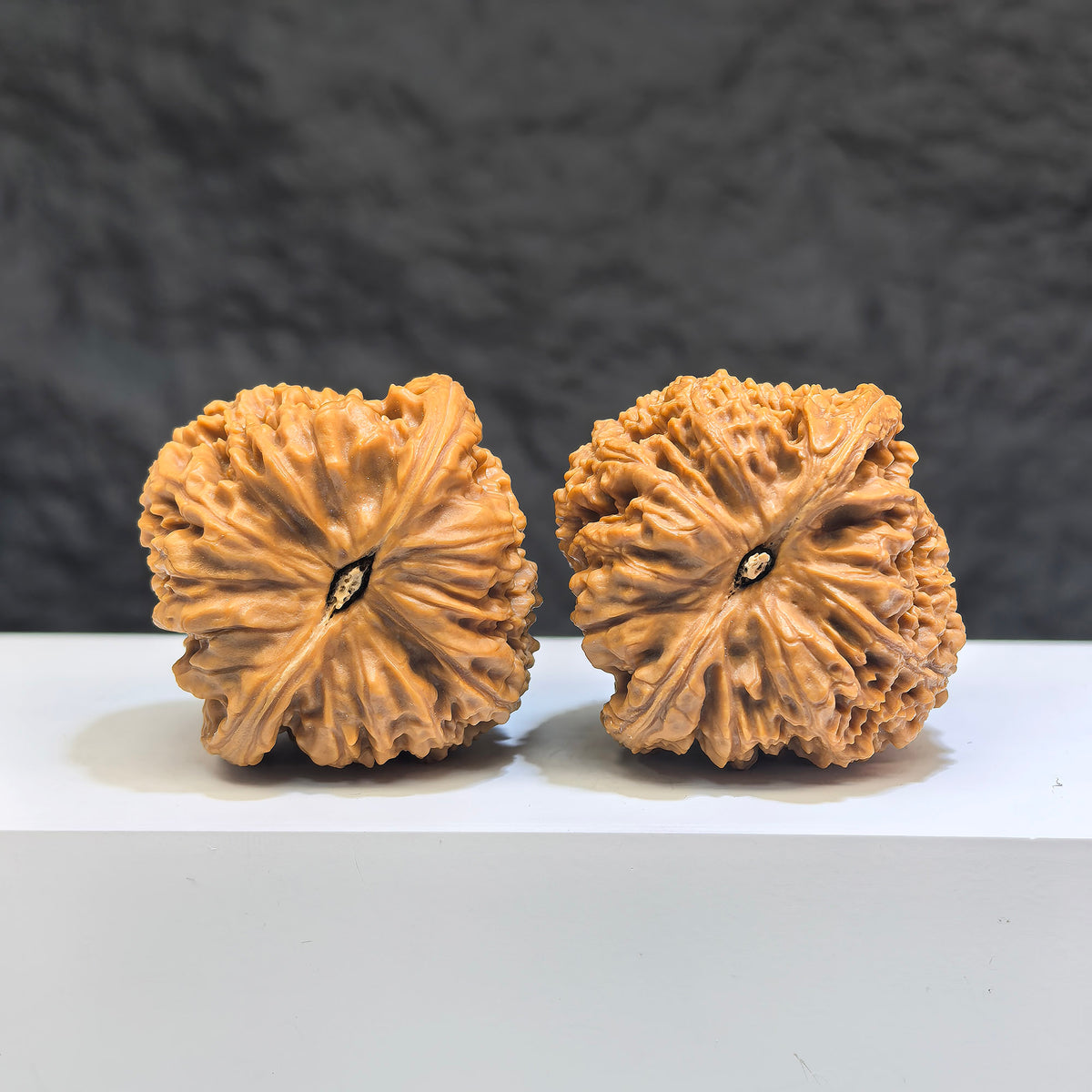 Pair of Nanjiangstone Wenwan walnuts from Wenwan Art, 40mm x 40mm, featuring natural stone textures and traditional craftsmanship.