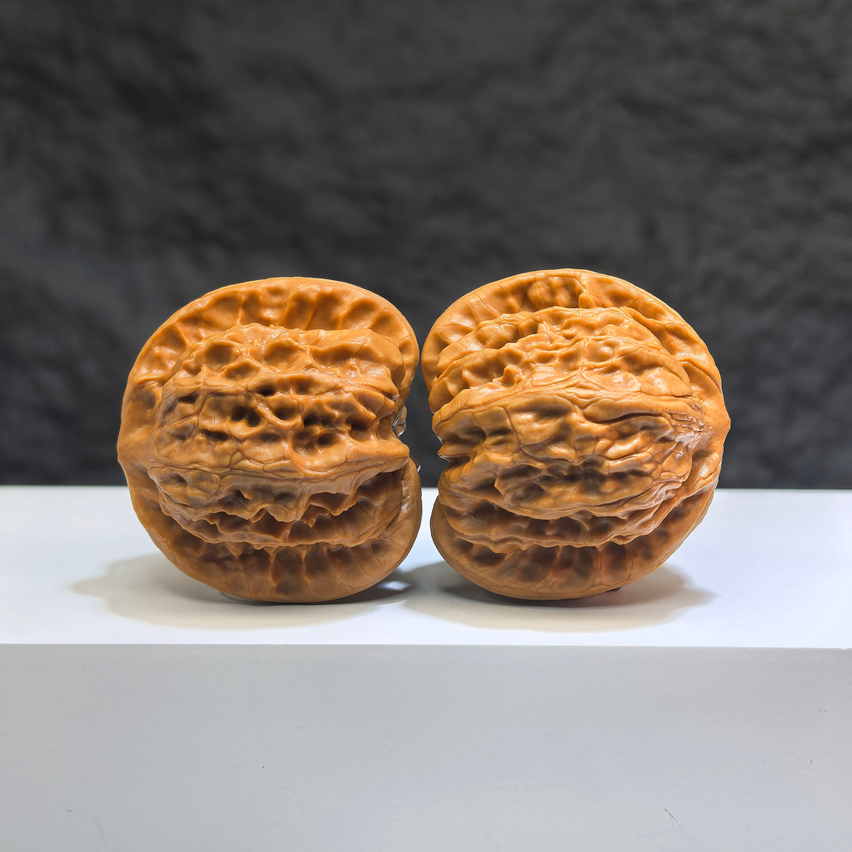 Pair of Wild Wolf Yelang Deep-Carved Wenwan Walnuts from Wenwan Art, 39mm x 37mm, detailed carved walnut art piece