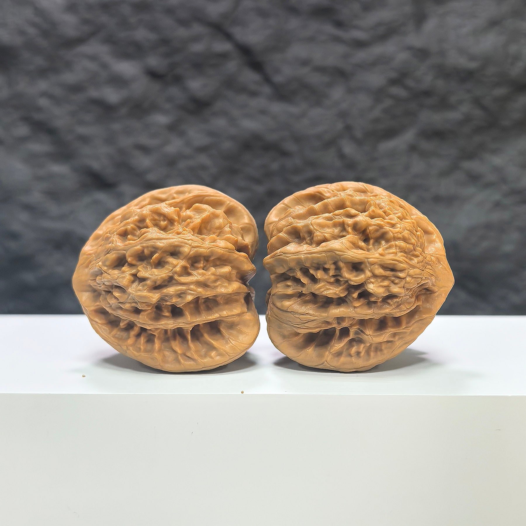 Pair of Peach Heart Concave Base Xiayunling Wenwan Walnuts from Wenwan Art, deep-base with smooth, rounded peach-shaped surface.