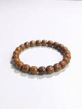 Natural Fortune Seed (Zi Jin Shu) classic barrel bracelet with 9mm beads, featuring smooth, polished stone beads on a flexible cord.